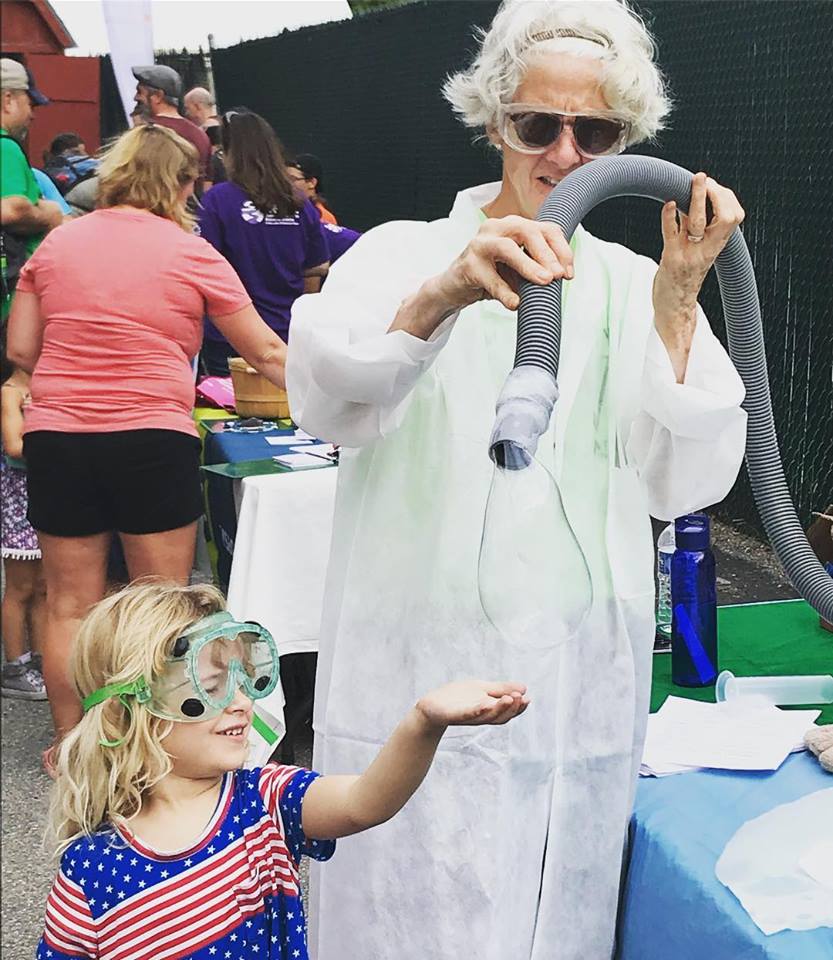 Coordinator of academic services Amy Stuart helps a future CCV student get psyched about STEM at a Lake Monsters game this summer.