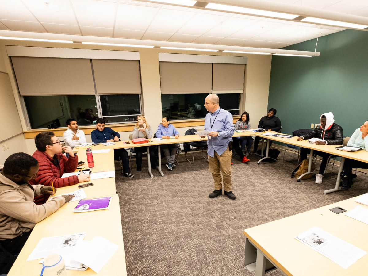 Instructor Gilberto Diaz Santos leads a discussion in his English for Academic Purposes class.