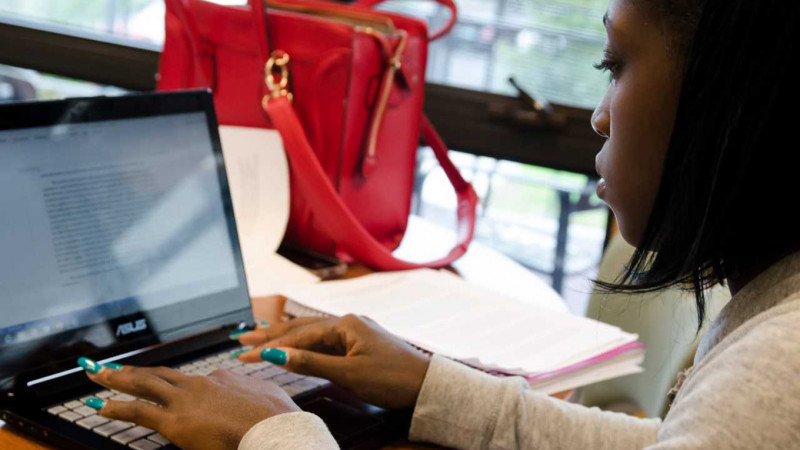 A CCV student at work on a laptop.