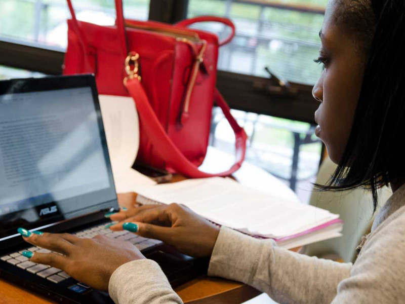 A CCV student at work on a laptop.