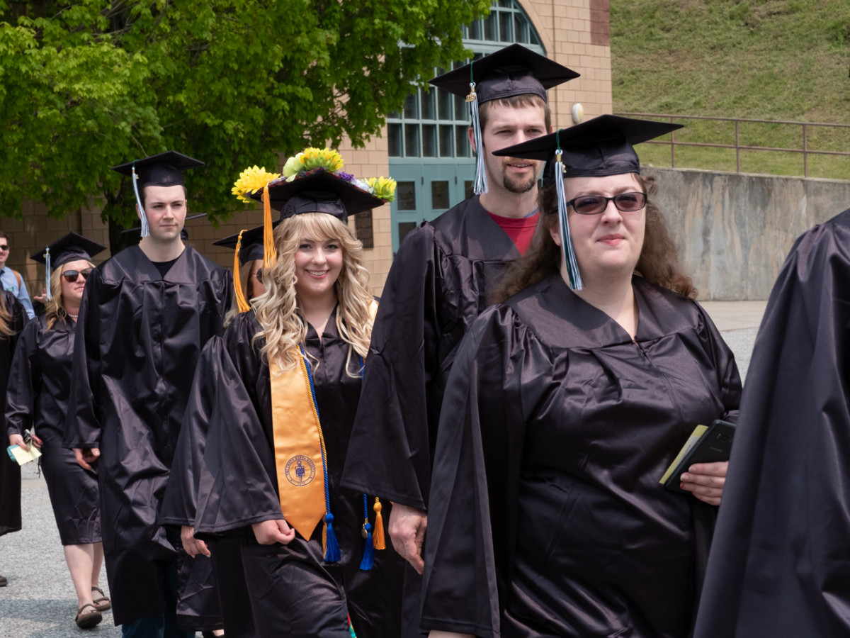 Students walk toward Shapiro Field House.