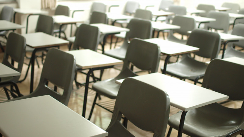 desks and chairs in an empty classroom