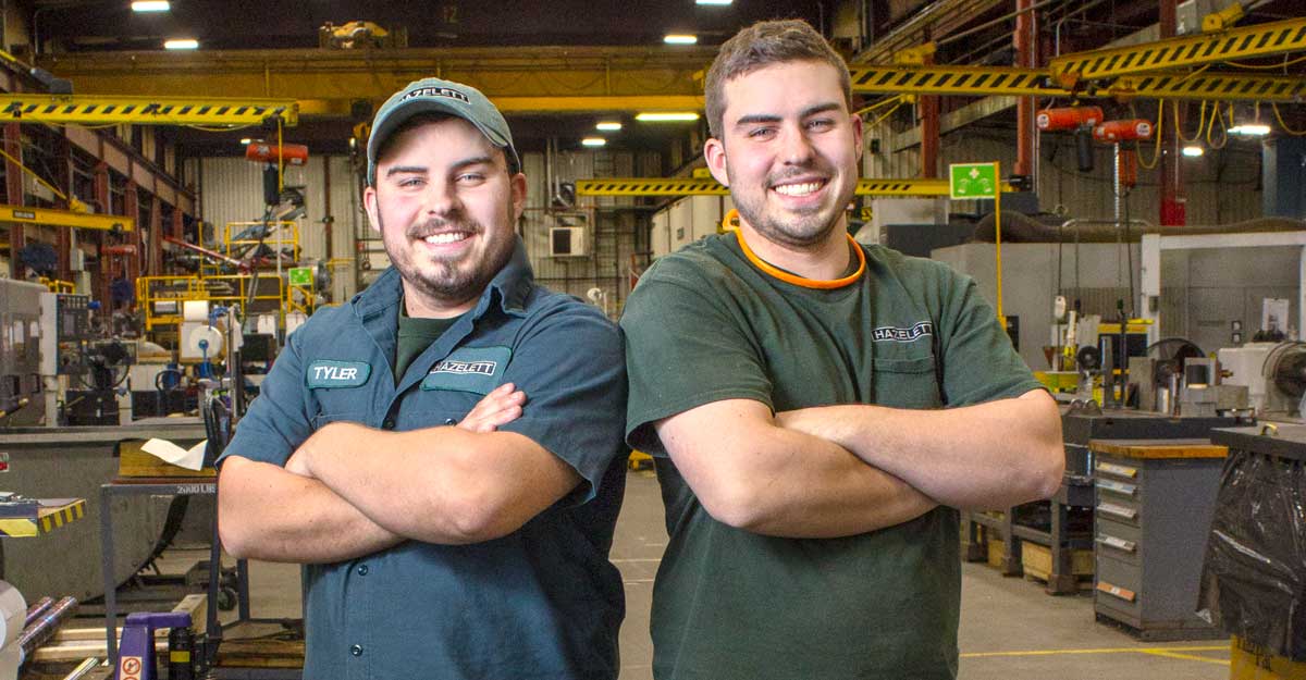 Two men inside manufacturing plant