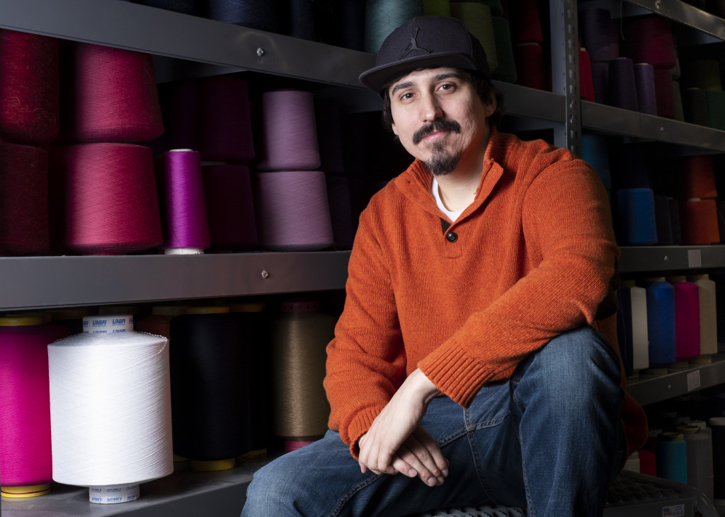 Man sitting in front of thread