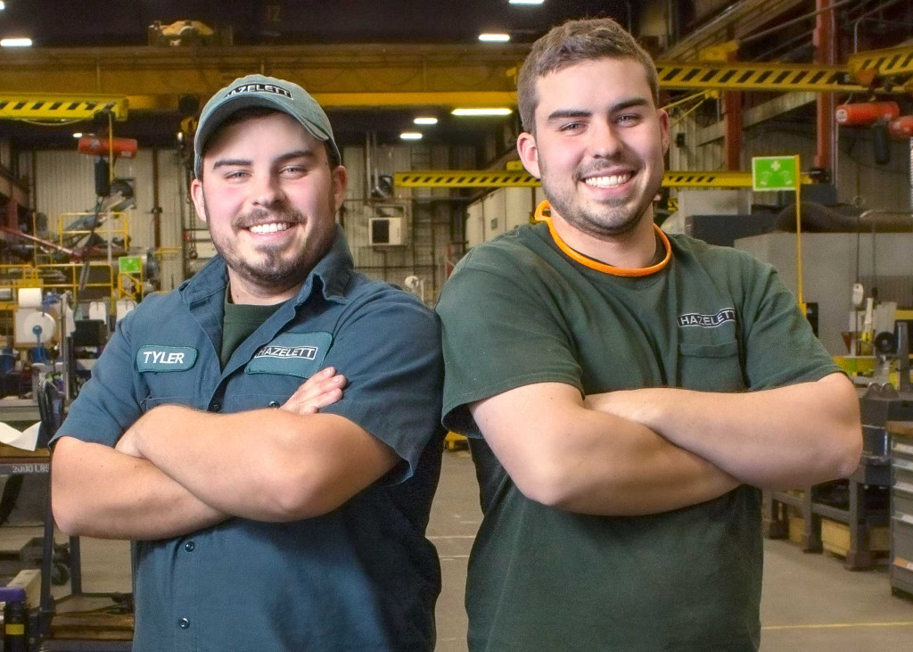 Two men inside manufacturing plant