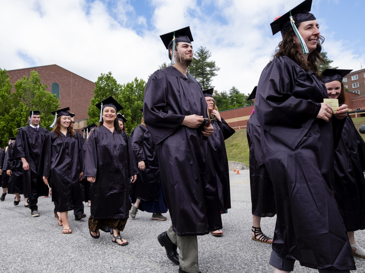 Graduates walking to commencement