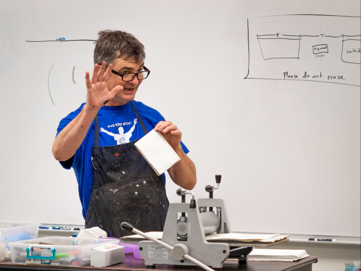 Faculty member in front of printmaking class