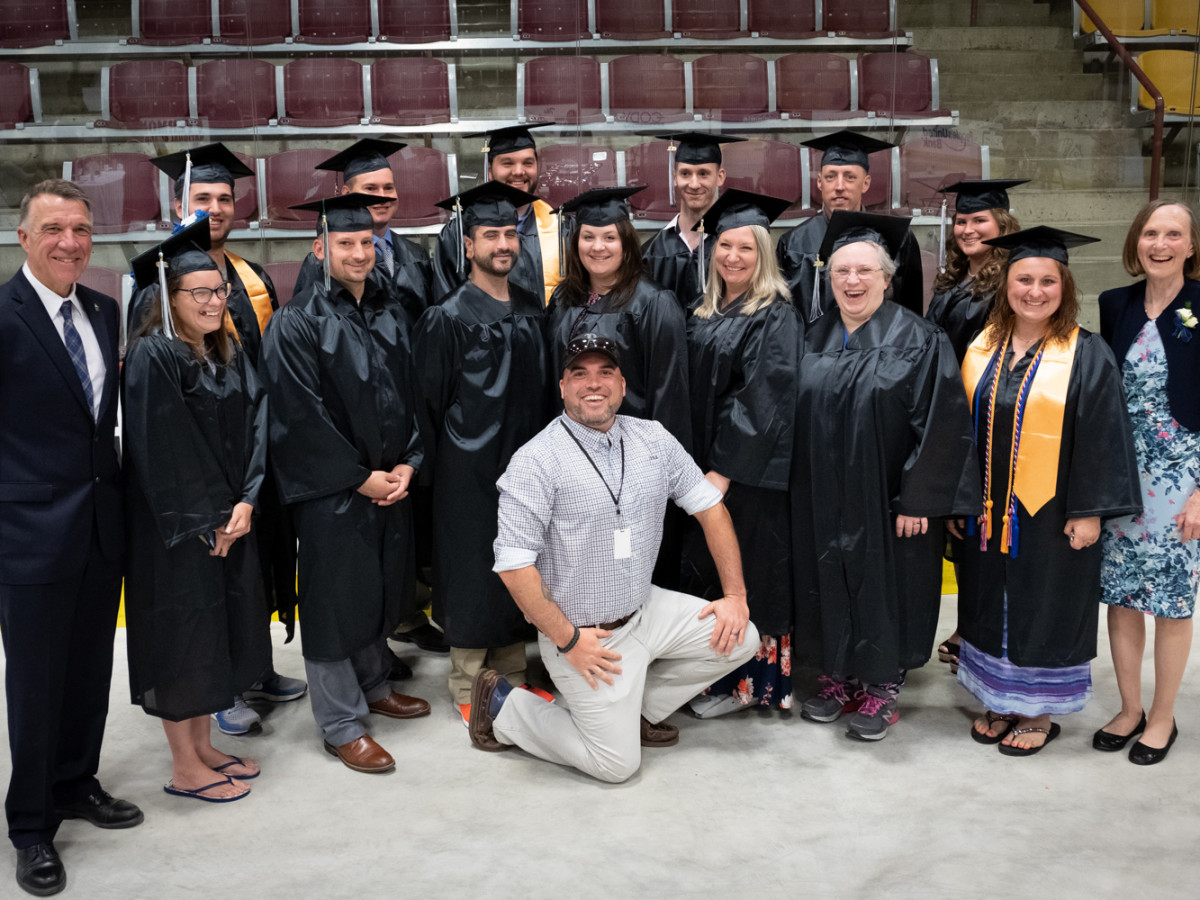 Veteran and military graduates with Governor Phil Scott at CCV's 2019 commencement.